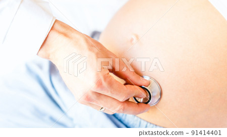 Pregnant doctor hospital. Medical clinic for pregnancy consultant. Doctor examining pregnancy woman belly holding stethoscope. Pregnancy, medicine health care concept. Pregnant doctor hospital. Medical clinic for pregnancy consultant. Doctor examining pregnancy woman belly holding stethoscope. Pregnancy, medicine health care concept. 91414401