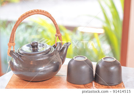 hand pour Chinese or Japanese traditional tea from clay pot hand pour Chinese or Japanese traditional tea from clay pot 91414515