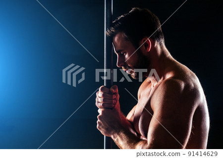 Muscular fitness man antique statue perfect muscles six pack abs and bare nude chest bodybuilder Apollo model posing on a black background in the studio. Concept functional training workout gym 91414629