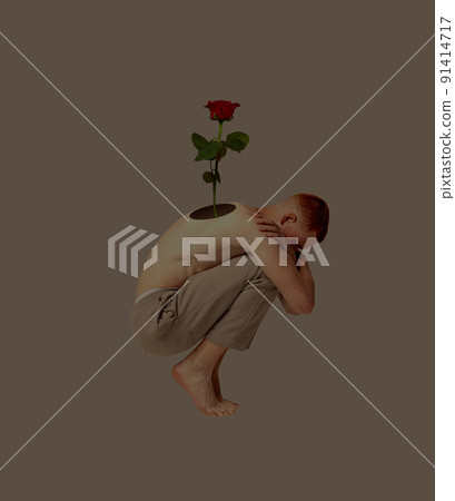 Contemporary art collage. Conceptual image with young man having hole into body with growing flower. Rising positive emotions Contemporary art collage. Conceptual image with young man having hole into body with growing flower. Rising positive emotions 91414717