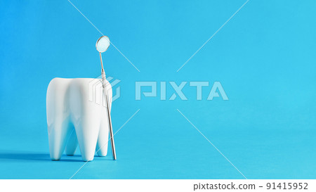 White dental tooth model with dentistry tools for teeth dental care on blue background. White dental tooth model with dentistry tools for teeth dental care on blue background. 91415952