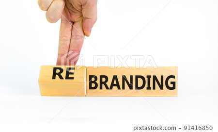 Branding or rebranding symbol. Businessman turns wooden cubes and changes the word Branding to Rebranding. Beautiful white table white background, copy space. Business branding rebranding concept. 91416850