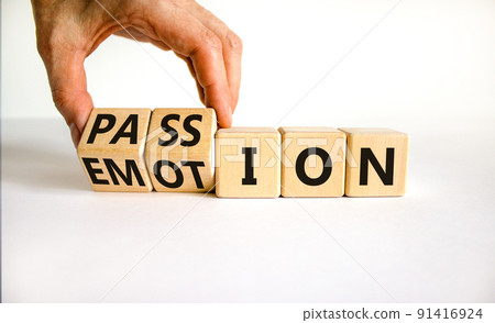 Passion or emotion symbol. Businessman turns wooden cubes and changes the word 'emotion' to 'passion'. Beautiful white table, white background, copy space. Business, passion or emotion concept. Passion or emotion symbol. Businessman turns wooden cubes and changes the word 'emotion' to 'passion'. Beautiful white table, white background, copy space. Business, passion or emotion concept. 91416924