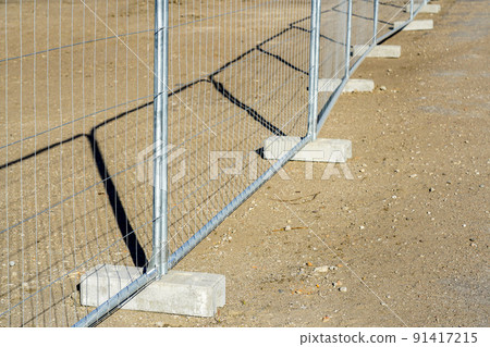 Temporary metallic portable fence with concrete base blocks to limit the territory 91417215
