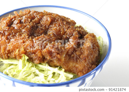 Sauce and bowl with cutlet entwined with plenty of sauce on top of shredded cabbage Sauce and bowl with cutlet entwined with plenty of sauce on top of shredded cabbage 91421874