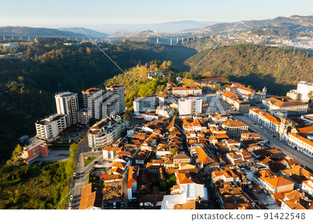 Drone view of Vila Real cityscape with viaduct crossing Corgo River in background 91422548