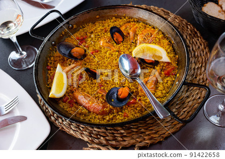 Just cooked paella de marisco on table 91422658