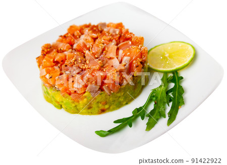 Salmon tartare with guacamole served on plate Salmon tartare with guacamole served on plate 91422922