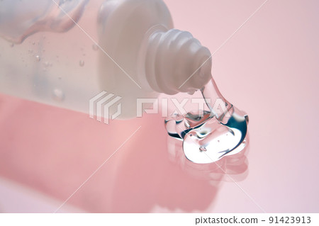 Hyaluronic gel or shower gel squeezed out of a bottle on a pink background. Hyaluronic gel or shower gel squeezed out of a bottle on a pink background. 91423913