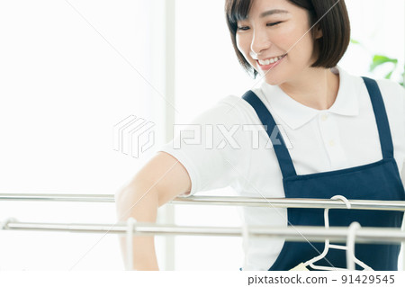 Housekeeping staff to hang laundry Housekeeping staff to hang laundry 91429545