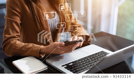 Business women working with smartphone and laptop and digital tablet computer in office with digital marketing media in virtual icon. Business women working with smartphone and laptop and digital tablet computer in office with digital marketing media in virtual icon. 91433114