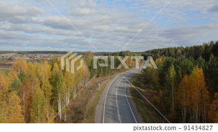 Asphalt road with traffic cars between forest in Ural 91434827