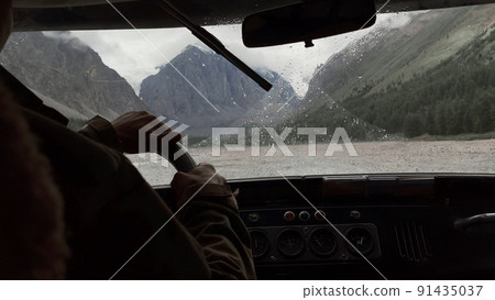 Looking through window of car to mountains of Aktru valley in Altai Looking through window of car to mountains of Aktru valley in Altai 91435037