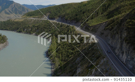 Cars on Chuya road between mountains and Katun river in Altai Cars on Chuya road between mountains and Katun river in Altai 91435110