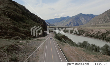 Mountains valley of Altai with traffic cars on Chuya highway and Katun river Mountains valley of Altai with traffic cars on Chuya highway and Katun river 91435126