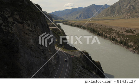 Mountains valley of Altai with traffic cars on Chuya highway and Katun river Mountains valley of Altai with traffic cars on Chuya highway and Katun river 91435127