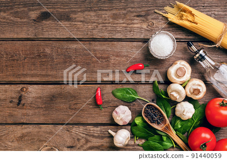 Italian food ingredients for the preparation pasta on wooden background Italian food ingredients for the preparation pasta on wooden background 91440059