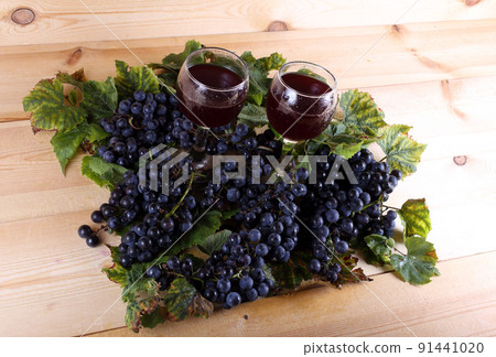 Grape and wine on table Grape and wine on table 91441020