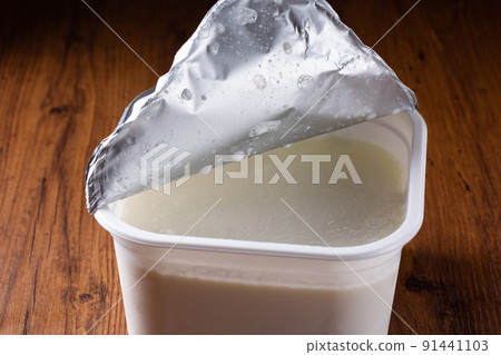 Yogurt in a plastic container 91441103