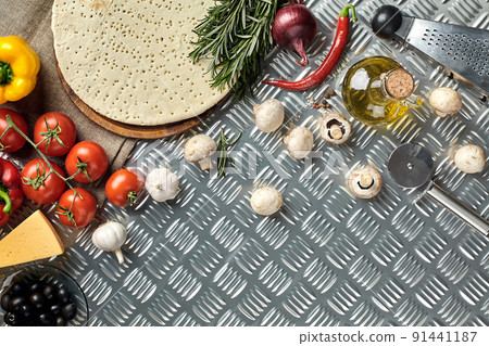 Ingredients for cooking pizza on metal table, top view Ingredients for cooking pizza on metal table, top view 91441187