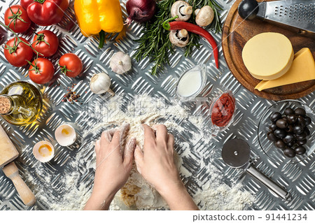 Young woman cooking in kitchen, closeup Young woman cooking in kitchen, closeup 91441234