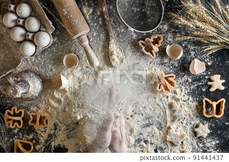 Top view female hands prepares a place for cooking dough 91441437