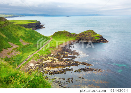 sunset over rocks formation Giants Causeway, County Antrim, Northern Ireland, UK 91443034