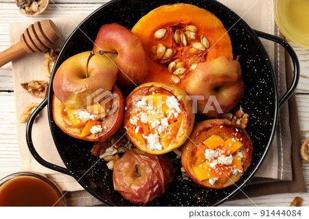 Concept of tasty food with baked apple, close up Concept of tasty food with baked apple, close up 91444084
