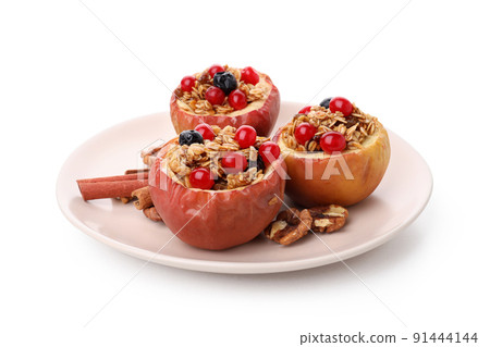 Concept of tasty food with baked apples isolated on white background 91444144