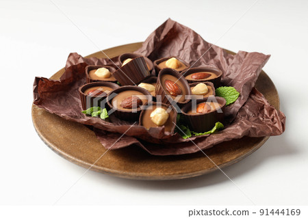 Concept of sweets with chocolate candies on white background 91444169