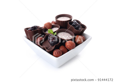 Chocolate candy in bowl isolated on white background Chocolate candy in bowl isolated on white background 91444172
