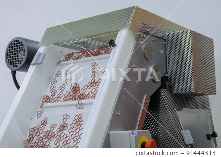 Plastic details moving on conveyor belt at exhibition, factory Plastic details moving on conveyor belt at exhibition, factory 91444313