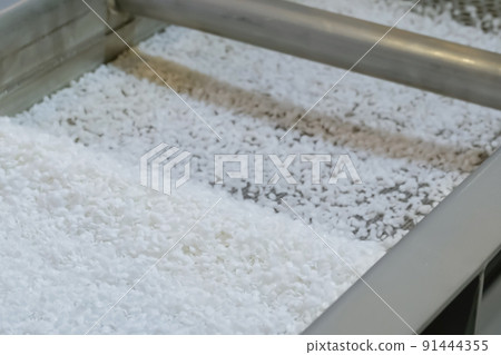 Recycled plastic granules on automatic shale shaker, conveyor belt - close up Recycled plastic granules on automatic shale shaker, conveyor belt - close up 91444355