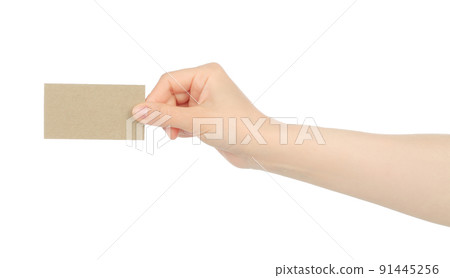 Hand holds blank business card on white background Hand holds blank business card on white background 91445256