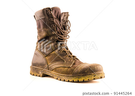 dirty military style light ankle boots isolated on white background dirty military style light ankle boots isolated on white background 91445264