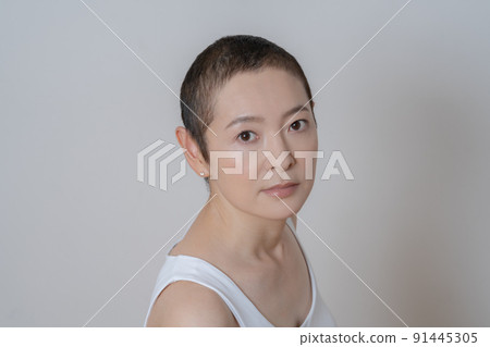 Portrait of middle age woman with very short hairstyle Portrait of middle age woman with very short hairstyle 91445305