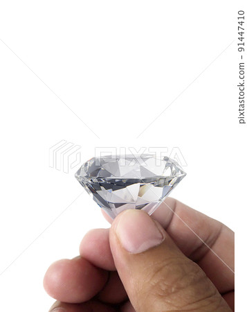Diamond jewel in hand, isolated on white background Diamond jewel in hand, isolated on white background 91447410