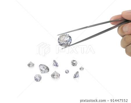 Selected diamonds In the gemstone clamp for making jewelry on white background Selected diamonds In the gemstone clamp for making jewelry on white background 91447552