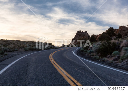 Scenic highway in the mountain landscape. Sunset Sky. Scenic highway in the mountain landscape. Sunset Sky. 91448217