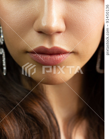 Cosmetics, makeup and trends. Bright lip gloss and lipstick on lips. Closeup of beautiful female mouth with natural lip makeup. Beautiful part of female face. Perfect clean skin Cosmetics, makeup and trends. Bright lip gloss and lipstick on lips. Closeup of beautiful female mouth with natural lip makeup. Beautiful part of female face. Perfect clean skin 91450136