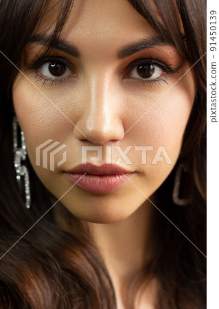 Close-up portrait of a beauty woman with full lips, straight hair and perfectly clean skin. Daytime makeup, styling and soft care. Skin care in the spa salon or cosmetology, smooth eyebrows 91450139