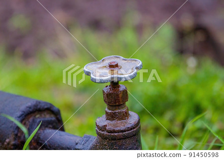 Old rusty water valve that leaks 91450598