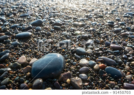 Colored blue and yellow sea stones background. Top view Colored blue and yellow sea stones background. Top view 91450703