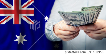 Business, finance and currency exchange concept in Australia. US dollars cash money in hand Business, finance and currency exchange concept in Australia. US dollars cash money in hand 91450953