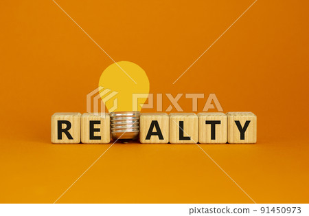 Realty symbol. Wooden cubes with word 'realty'. Yellow light bulb. Beautiful orange background. Business and realty concept. Copy space. Realty symbol. Wooden cubes with word 'realty'. Yellow light bulb. Beautiful orange background. Business and realty concept. Copy space. 91450973