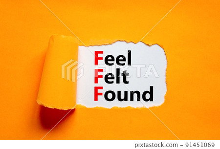FFF feel felt found technique symbol. Concept words FFF feel felt found on white paper on a beautiful orange background. Psychological FFF feel felt found technique concept. Copy space. 91451069