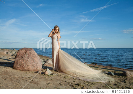 Fashion outdoor photo of beautiful woman with long hair Fashion outdoor photo of beautiful woman with long hair 91451126