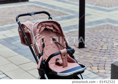 empty baby stroller near the open entrance to the store. 91452522