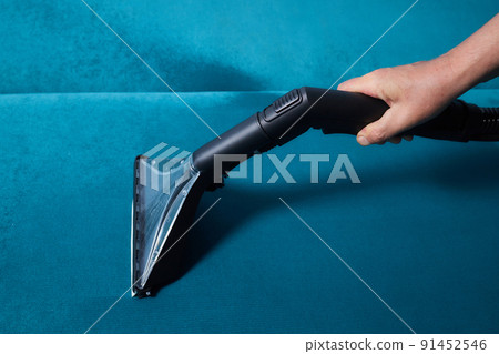 Dirty sofa chemical cleaning with professionally extraction method. Upholstered furniture. Early spring cleaning or regular clean up. 91452546