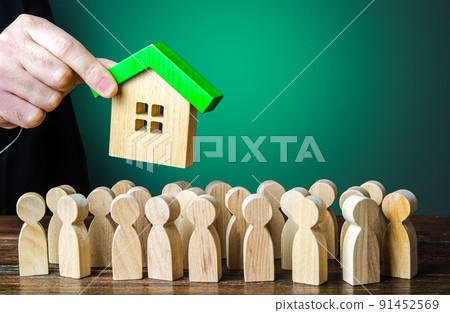 Affordable mortgage loan to buy housing. A government official hands over housing property. Residence permit and migration. Realtor sells real estate. Big waiting list, corruption risks. Affordable mortgage loan to buy housing. A government official hands over housing property. Residence permit and migration. Realtor sells real estate. Big waiting list, corruption risks. 91452569